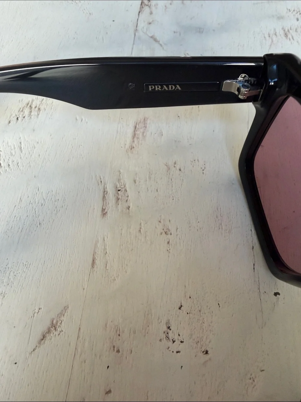 Prada Black Frame Sunglasses with Rose-Tinted Lenses